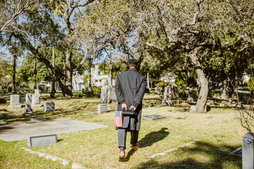 Air Force veteran proudly holding folded flag in uniform