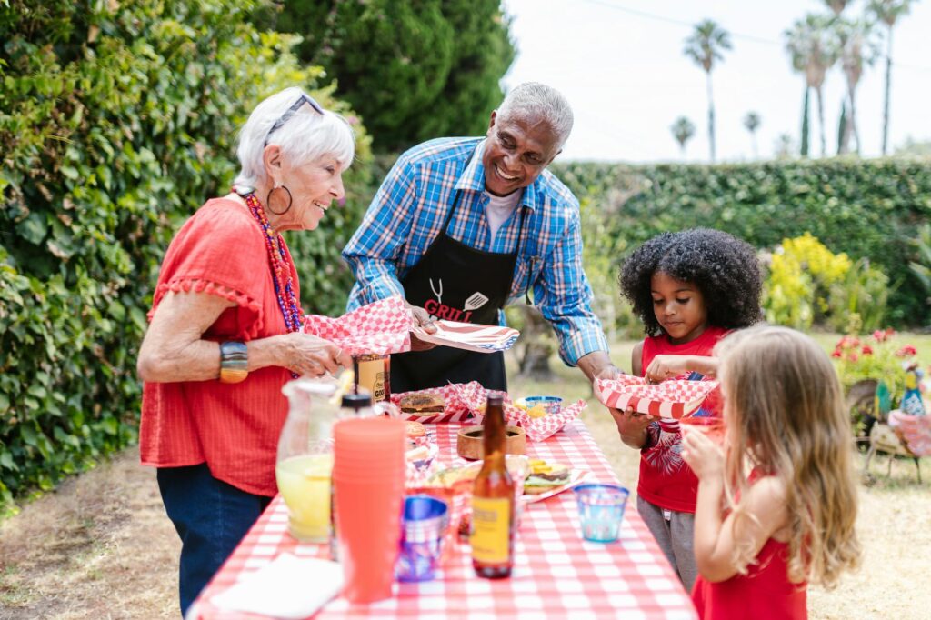 Military family wearing patriotic U.S. flag t-shirts outdoors
