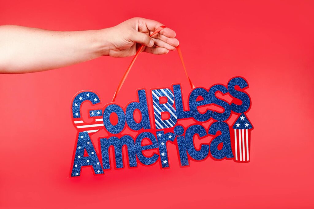 Military family displaying patriotic banner at home