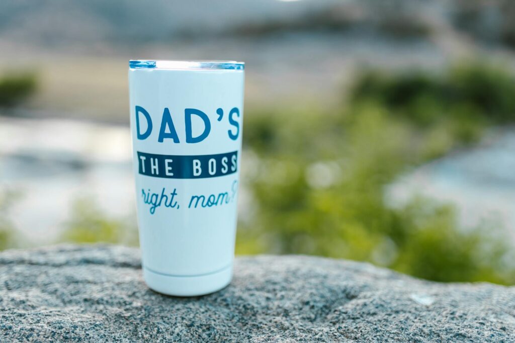 Dad wearing veteran-themed patriotic t-shirt with folded flag