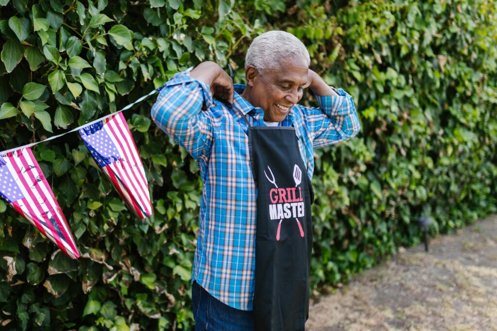 Man wearing patriotic veteran t-shirt with folded flag background